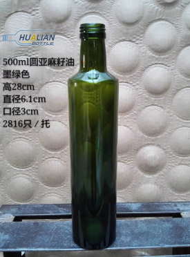 Dark green glass olive oil bottle